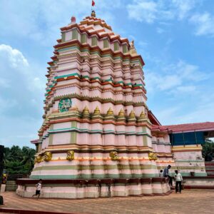 Beautiful view of Ganpatipule Temple in Maharashtra, a famous tourist attraction with vibrant architecture.